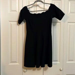 Black dress with beautiful scalloped neckline.